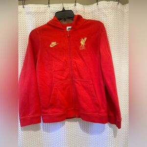 Nike Sportswear Liverpool FC Youth Full Zip Hoodie in university red and gold.